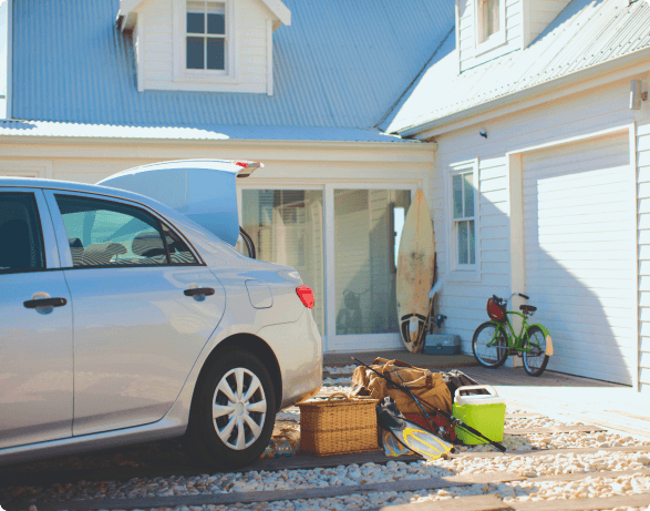 a car with a pile of objects in front of it