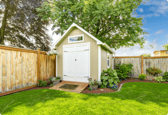 a small shed in a backyard