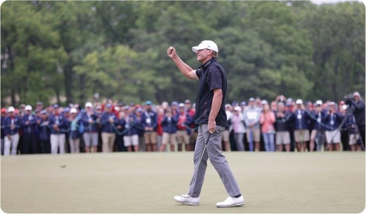 a man holding a golf club