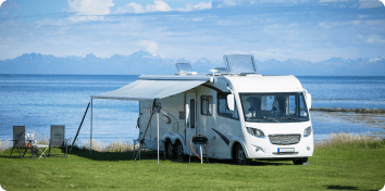 an RV parked by water