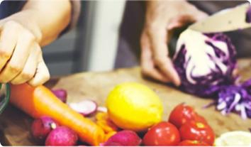 a person cutting vegetables