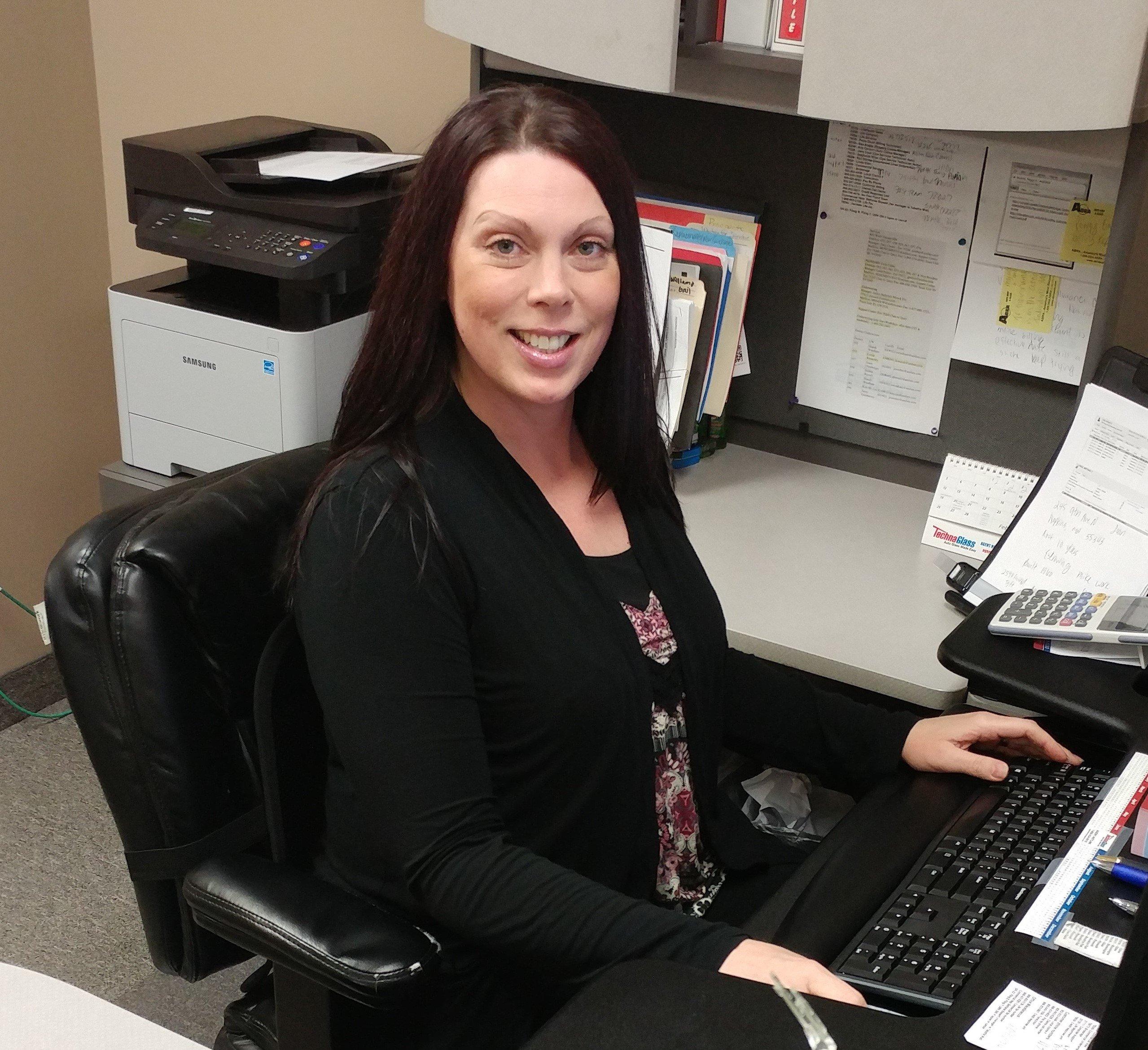 a woman sitting at a desk