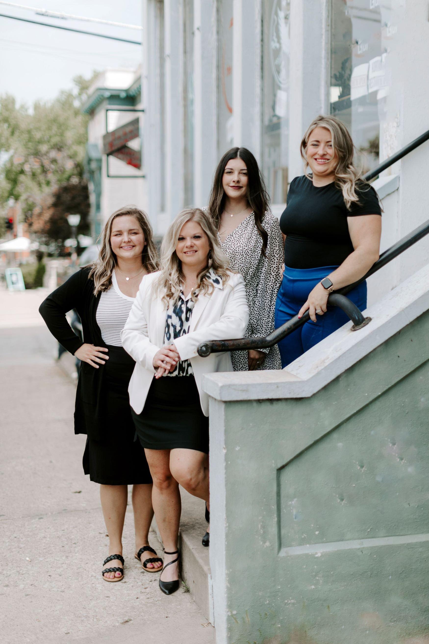 a group of women posing for a photo