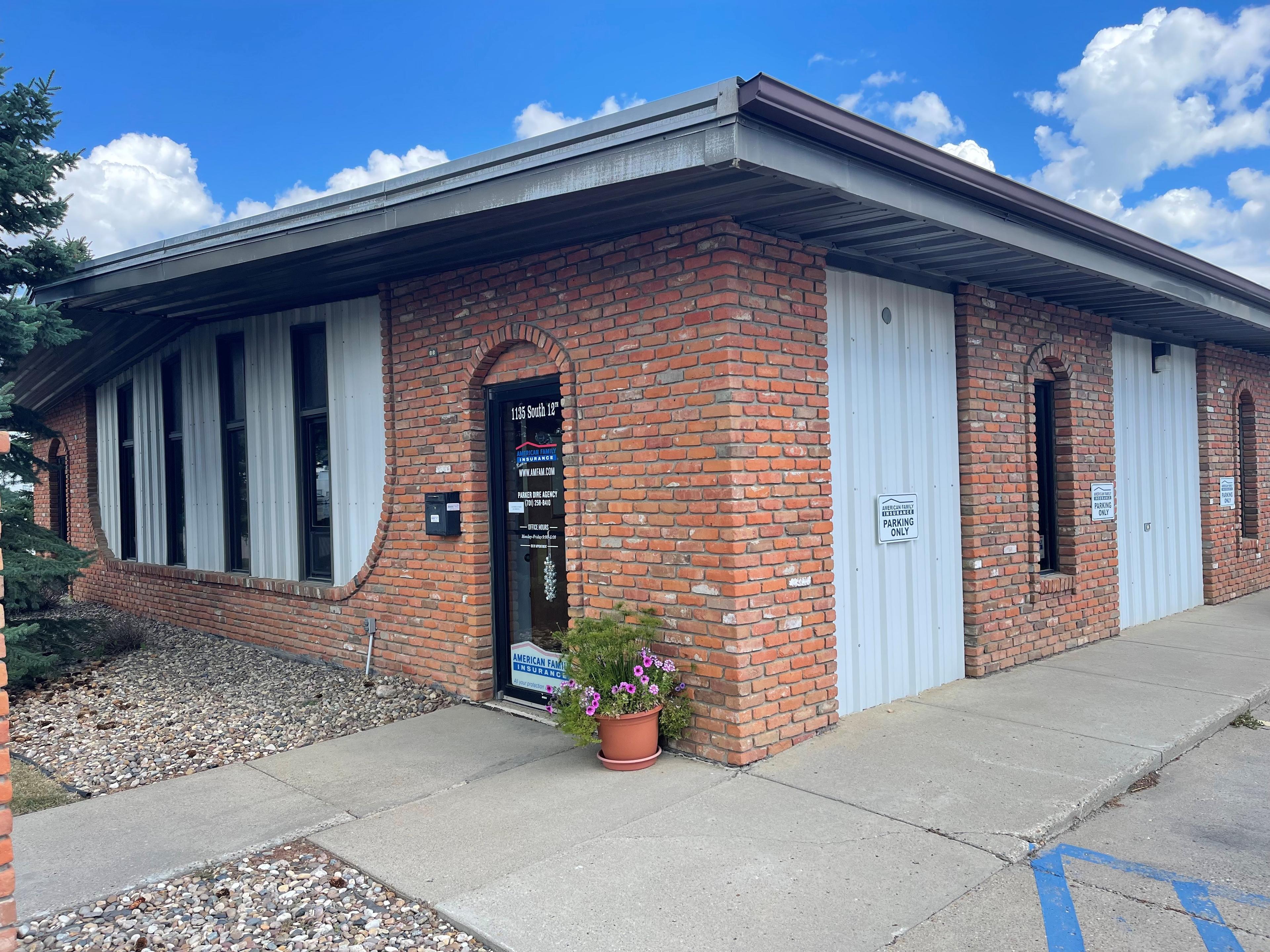 a brick building with white doors