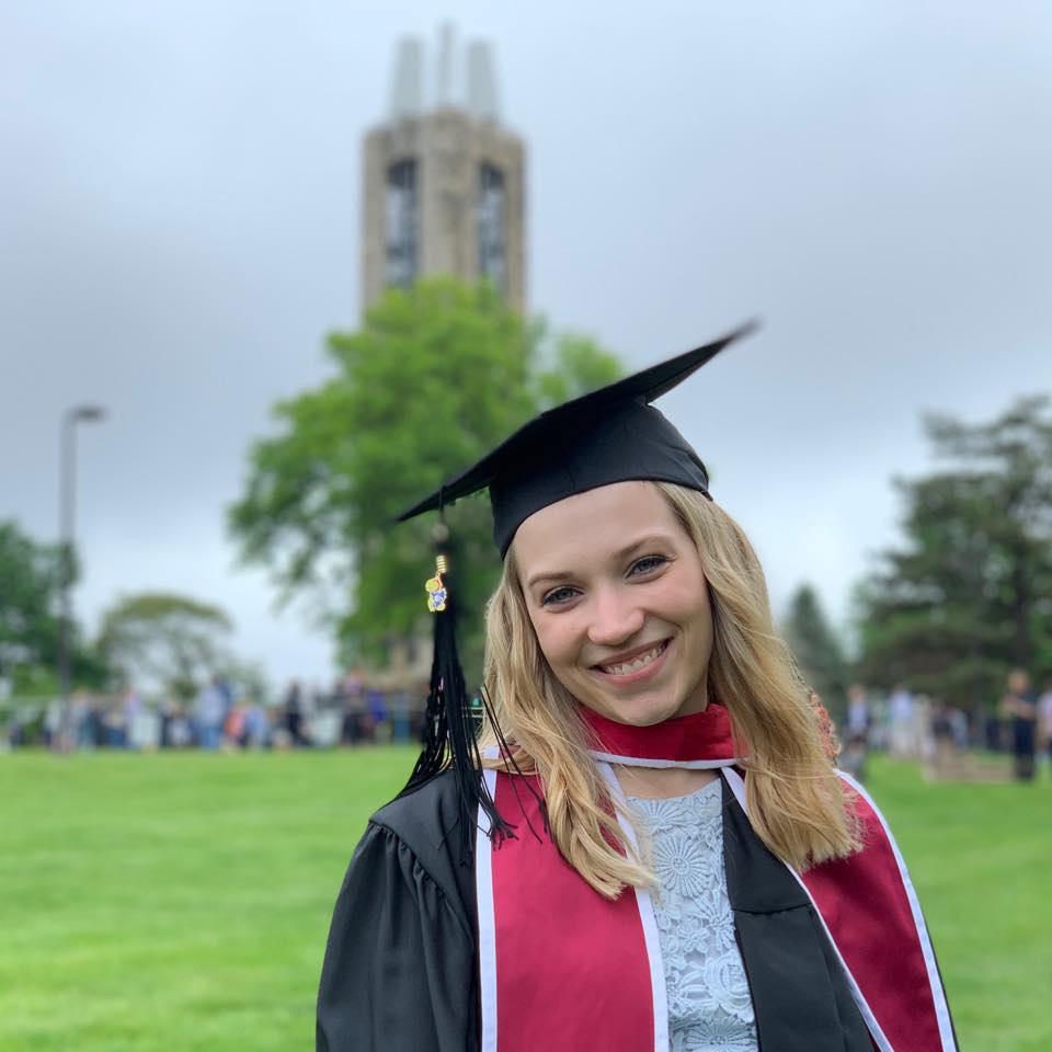 a person wearing a graduation cap and gown