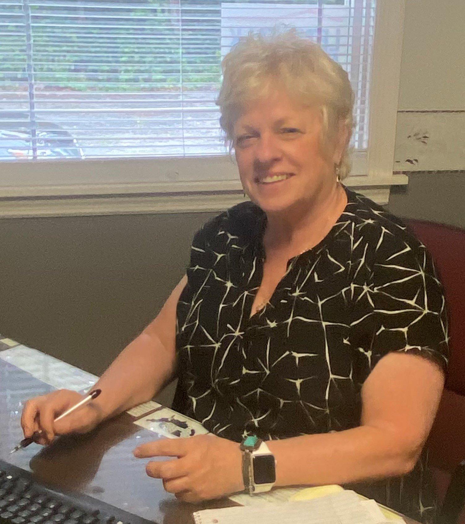 a woman sitting at a desk