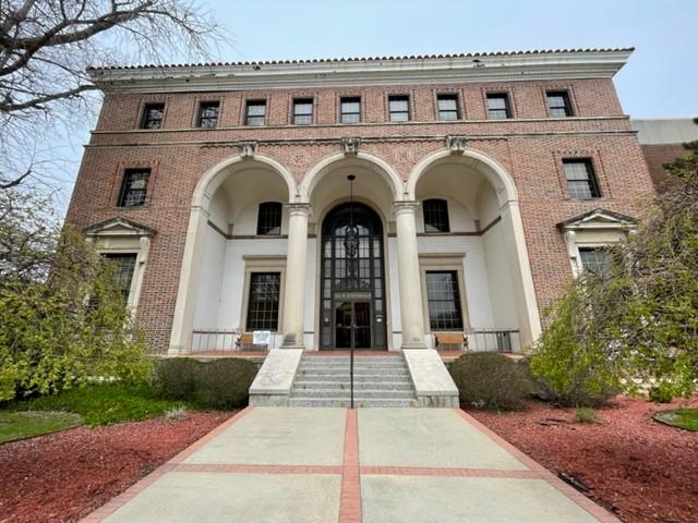 a large white building with pillars