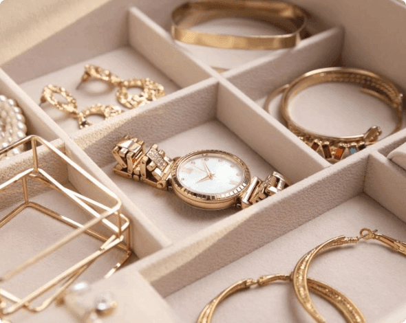 Close-up of jewelry sitting in an organized container.