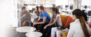 a group of people sitting around a table