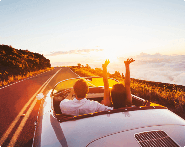 A couple going for a drive at sunset.