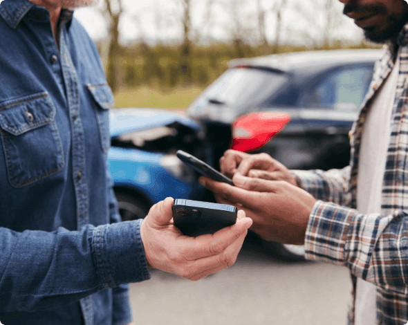 People exchanging info after a car accident