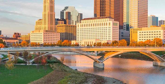 a bridge over a river in a city